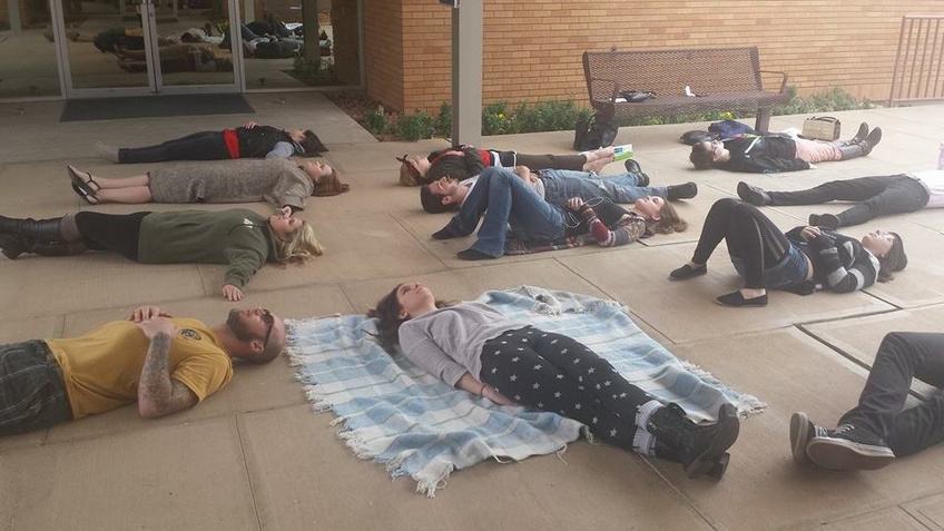 Fired Dixie State University theater professor Varlo Davenport's supporters do a mediative technique at a silent protest Jan. 29, the same day as Davenport's hearing. Photo Courtesy of Serena Dabney
