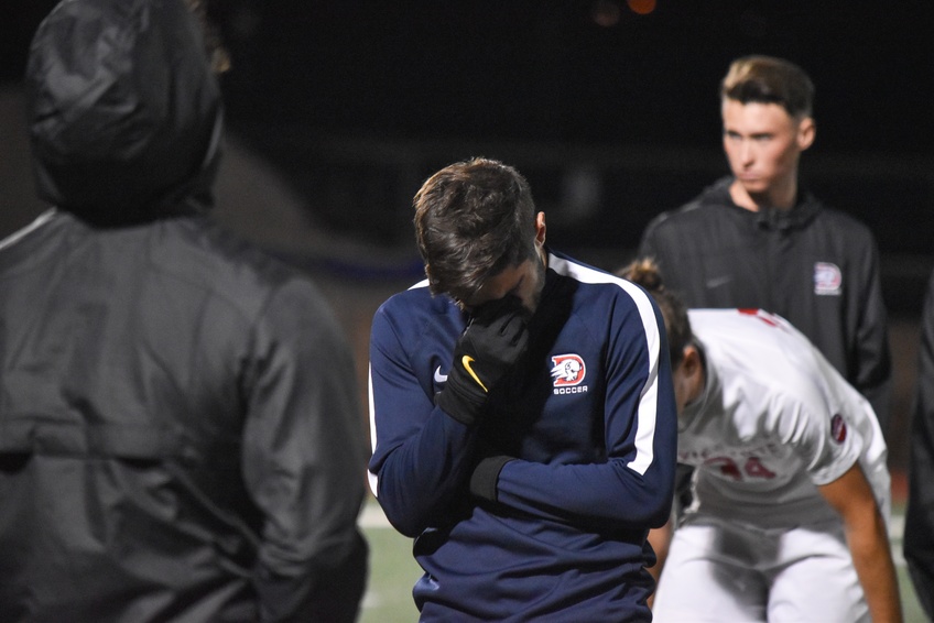  forward Ather Dawood, a psychology major from Tucson, Arizona, weeps after his teams loss to No. 1 PLNU. Photo by Kylea Custer. 
