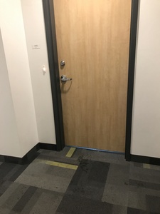 Peepholes were left off of front door, leaving students unable to see who was knocking before opening their doors. Peepholes were outlined on the list of things to be added included on the inside of the pantry.